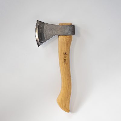A shiny sharp metal axe head on a curvy wooden handle, on a white background. The logo "Wood Tools" is engraved into the handle.